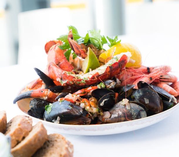 Assorted seafood platter with shrimp, mussels, crab, and lobster